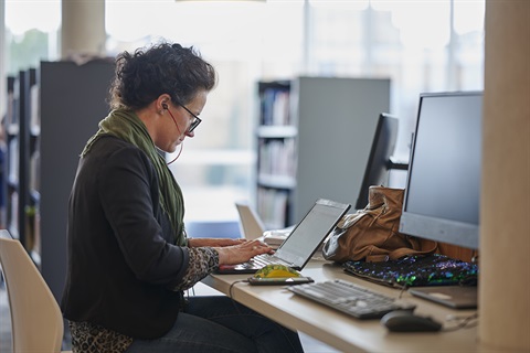 Woman on a laptop in the library