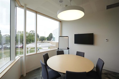 Empty meeting room with whiteboard and TV